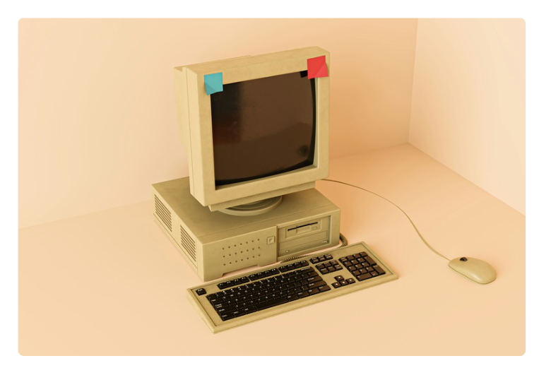 Picture of an old desktop computer with a blue and red post-it note on each corner. Picture of an old desktop computer with a blue and red post-it note on each corner.