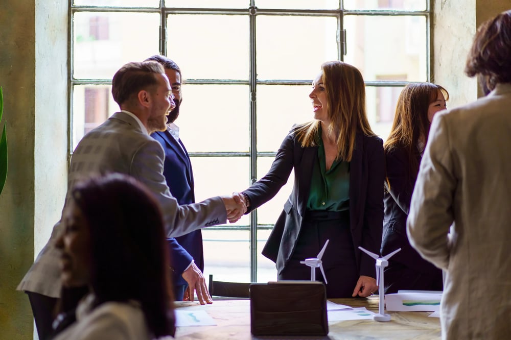business-professionals-greeting-with-a-handshake-2025-03-05-14-17-23-utc