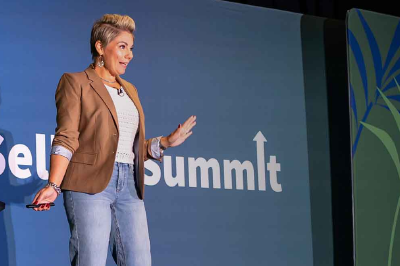 A candid highquality photo of a diverse group of focused professionals at a modern conference workshop table They are collaborating around a surfacehu-1