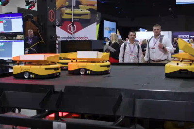 A conceptual illustration showing a physical cardboard shipping box dissolving into a stream of digital binary code and light particles that form a gl-1