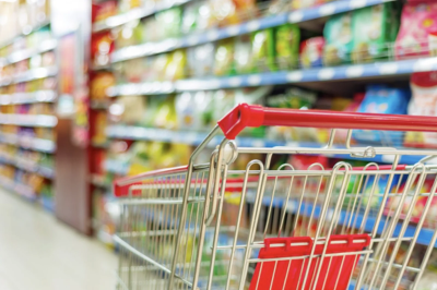 A candid cinematic photograph of diverse entrepreneurs and creators collaborating in a sunlit modern coworking loft They are gathered around a large t-1