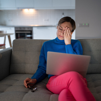 exhausted-young-female-sit-on-couch-closed-eyes-to-2025-03-07-19-23-33-utc-1