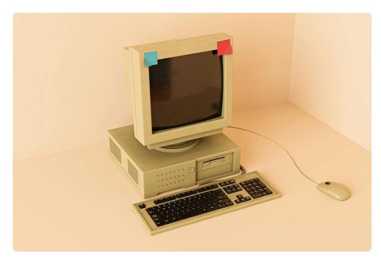 Picture of an old desktop computer with a blue and red post-it note on each corner. Picture of an old desktop computer with a blue and red post-it note on each corner.