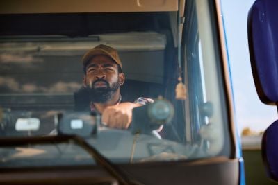 Truck driver looking out his front windshield.